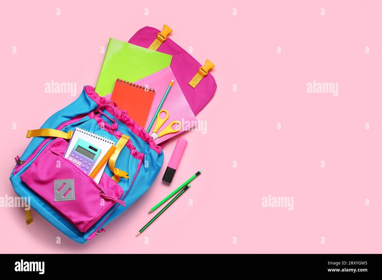 Stylish school backpack with different stationery on pink background Stock Photo