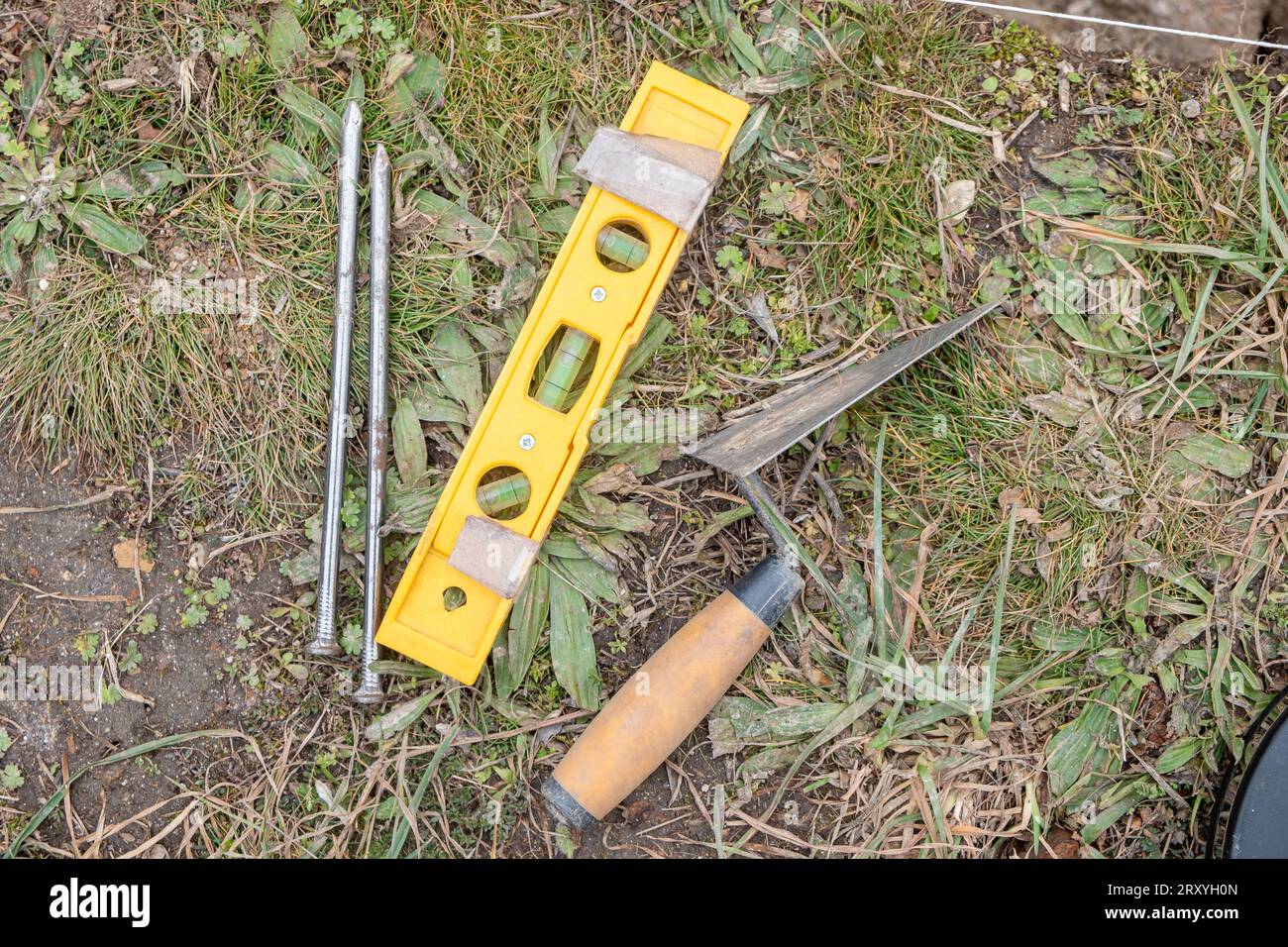 tools in an archaeological excavation, nails, hand level and trowel Stock Photo Alamy