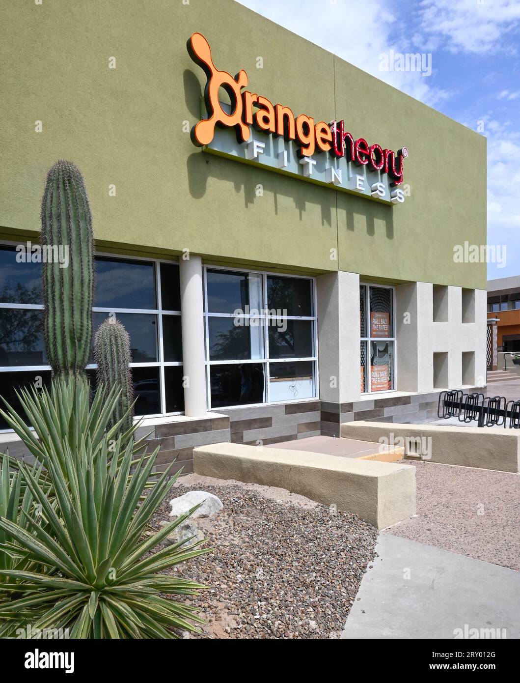 View of Orange Theory Fitness gym entrance accented with cactus plant