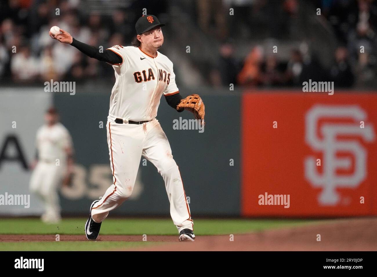 San Francisco Giants third baseman Wilmer Flores throws out San Diego  Padres' Jose Azocar at first base during the third inning of a baseball  game in San Francisco, Wednesday, Sept. 27, 2023. (