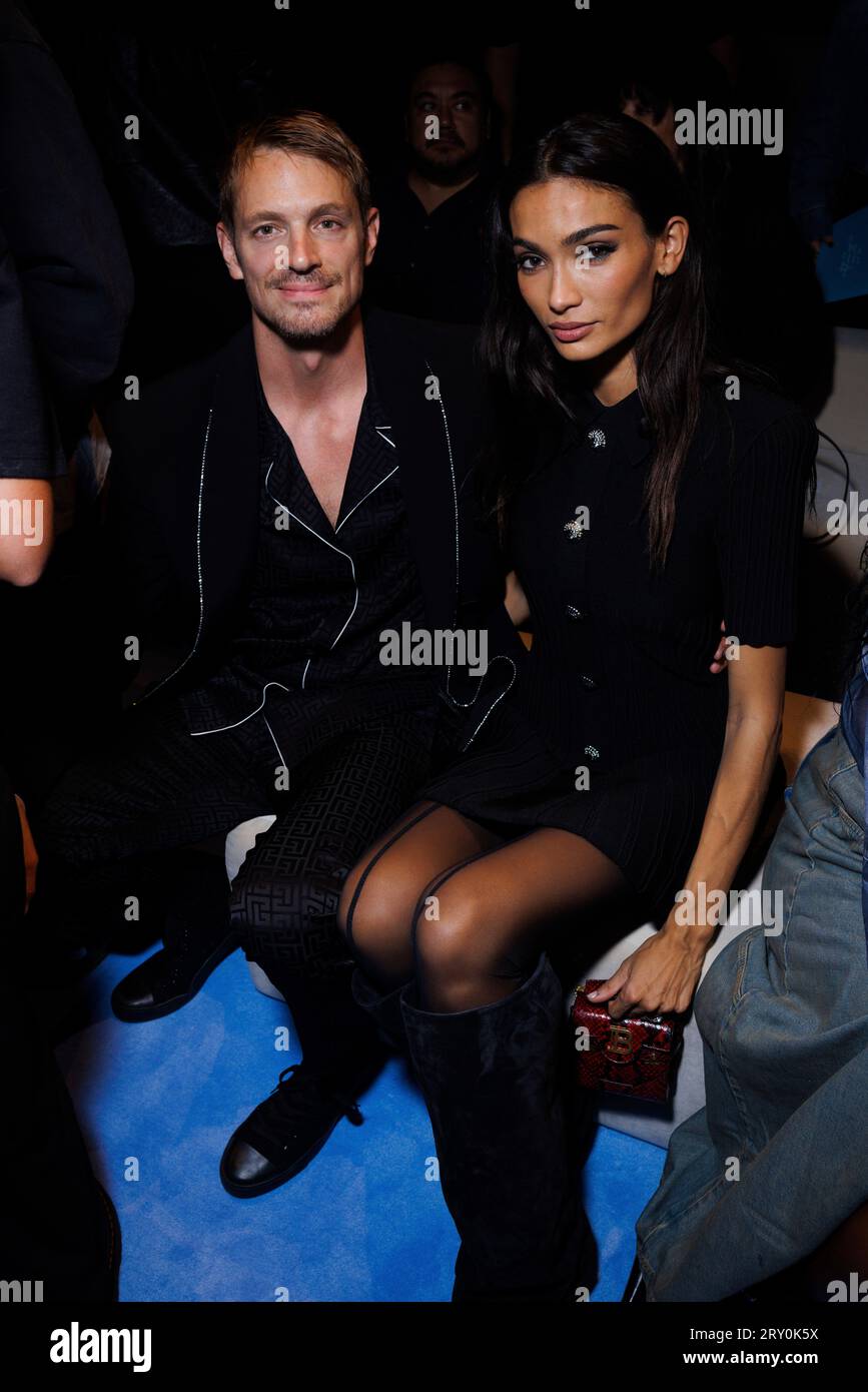 Joel Kinnaman and Kelly Gale attend the Balmain Spring/Summer 2024