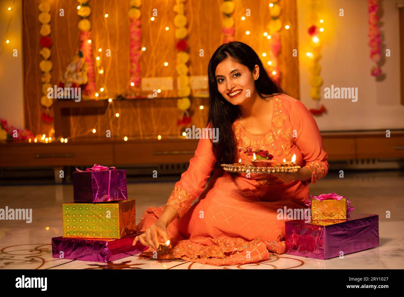 Portrait of a beautiful young smiling Indian woman in traditional dress ...
