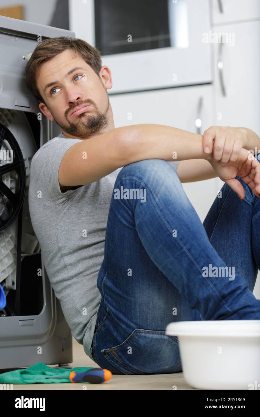 Tired after cleaning man hi-res stock photography and images - Alamy