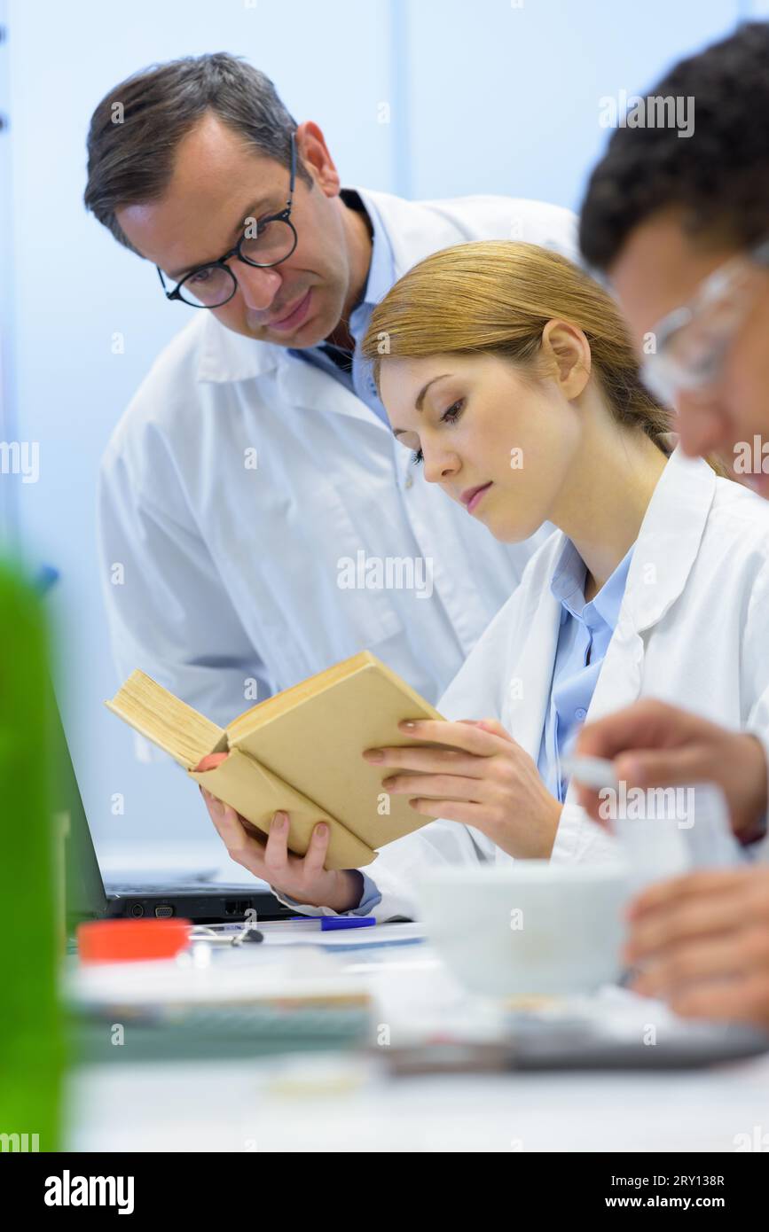 Woman scientists conducting experiment hi-res stock photography and ...