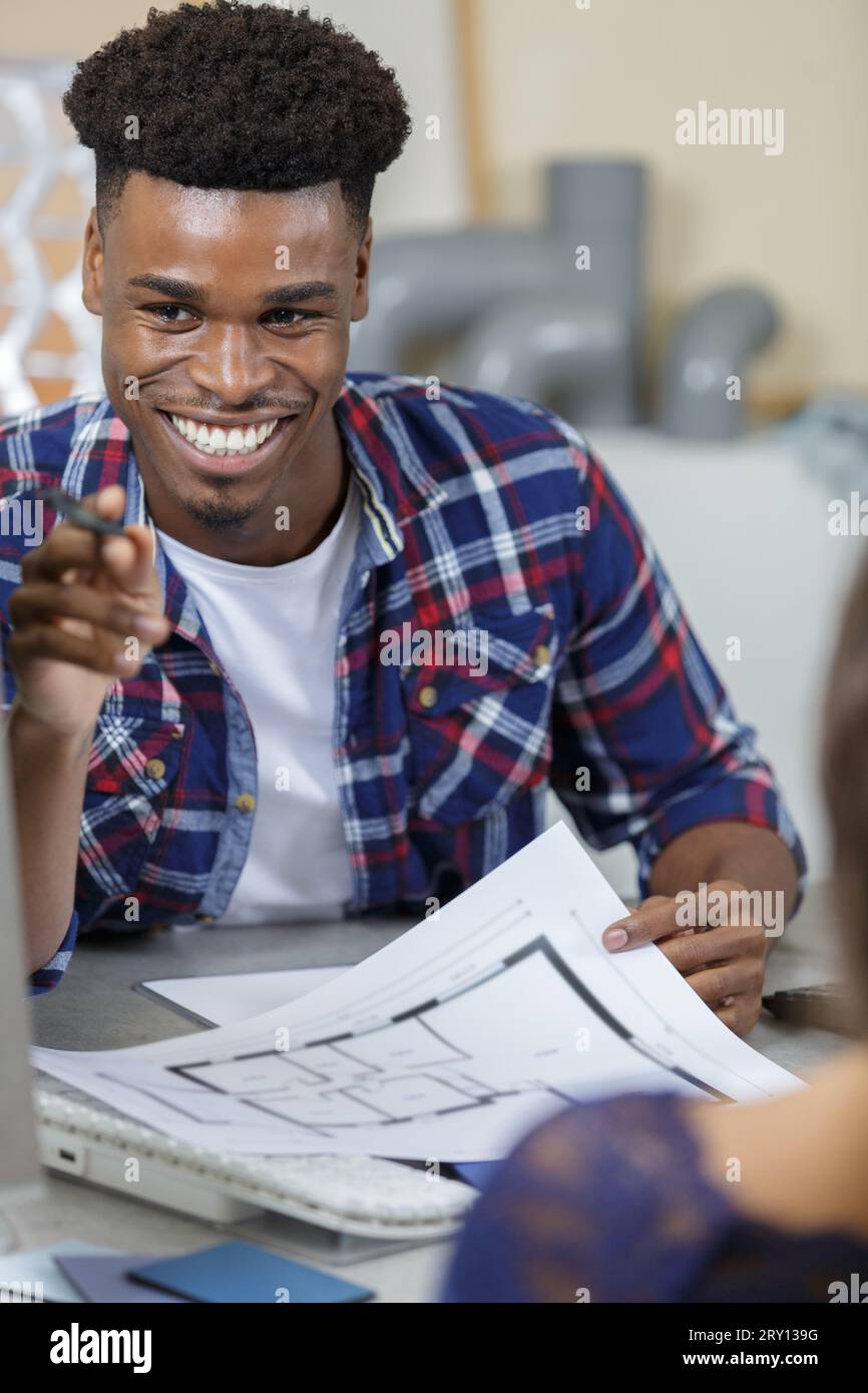 man standing in modern open plan office Stock Photo - Alamy