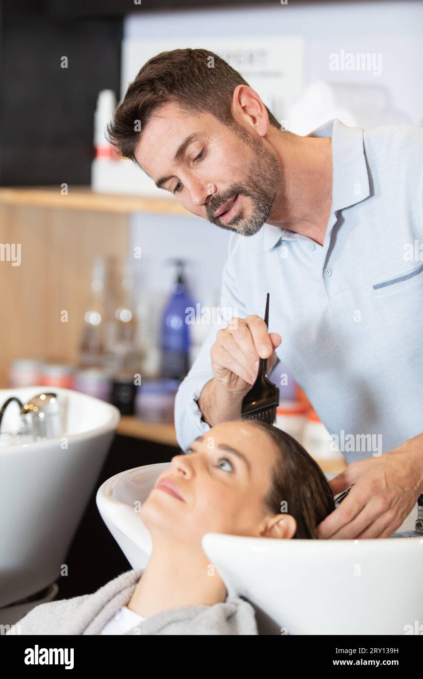 female client is taking picture with a stylist Stock Photo - Alamy
