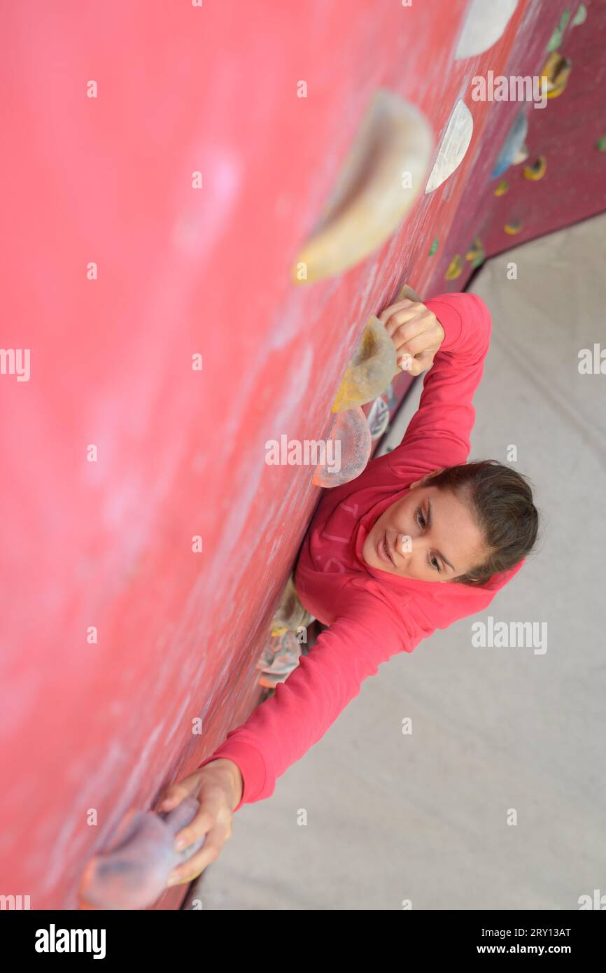 an athletic woman climbing indoors Stock Photo Alamy