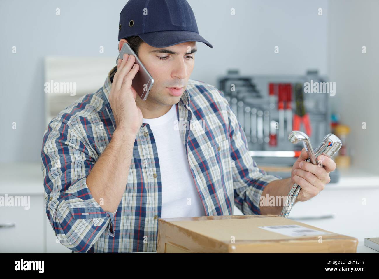 technician doing meter reading using mobilephone Stock Photo