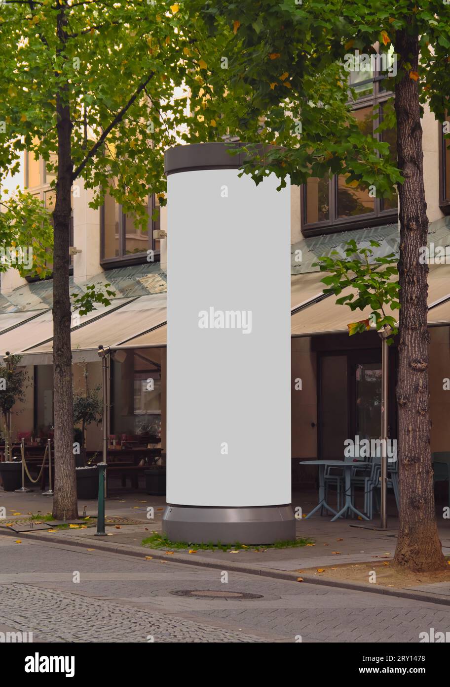 Empty advertising pillar in a city with grey  free copy space, promotion mock up. Blank advertising panel Stock Photo