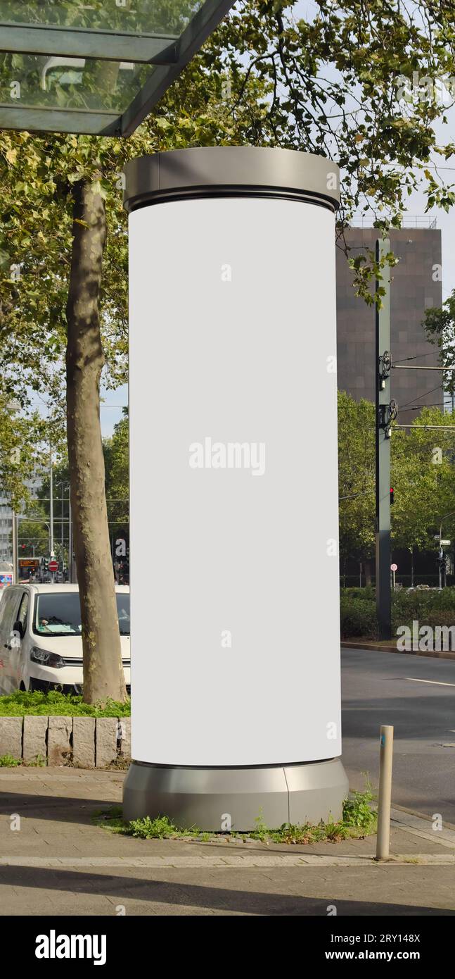 Empty advertising pillar in a city with grey  free copy space, promotion mock up. Blank advertising panel Stock Photo
