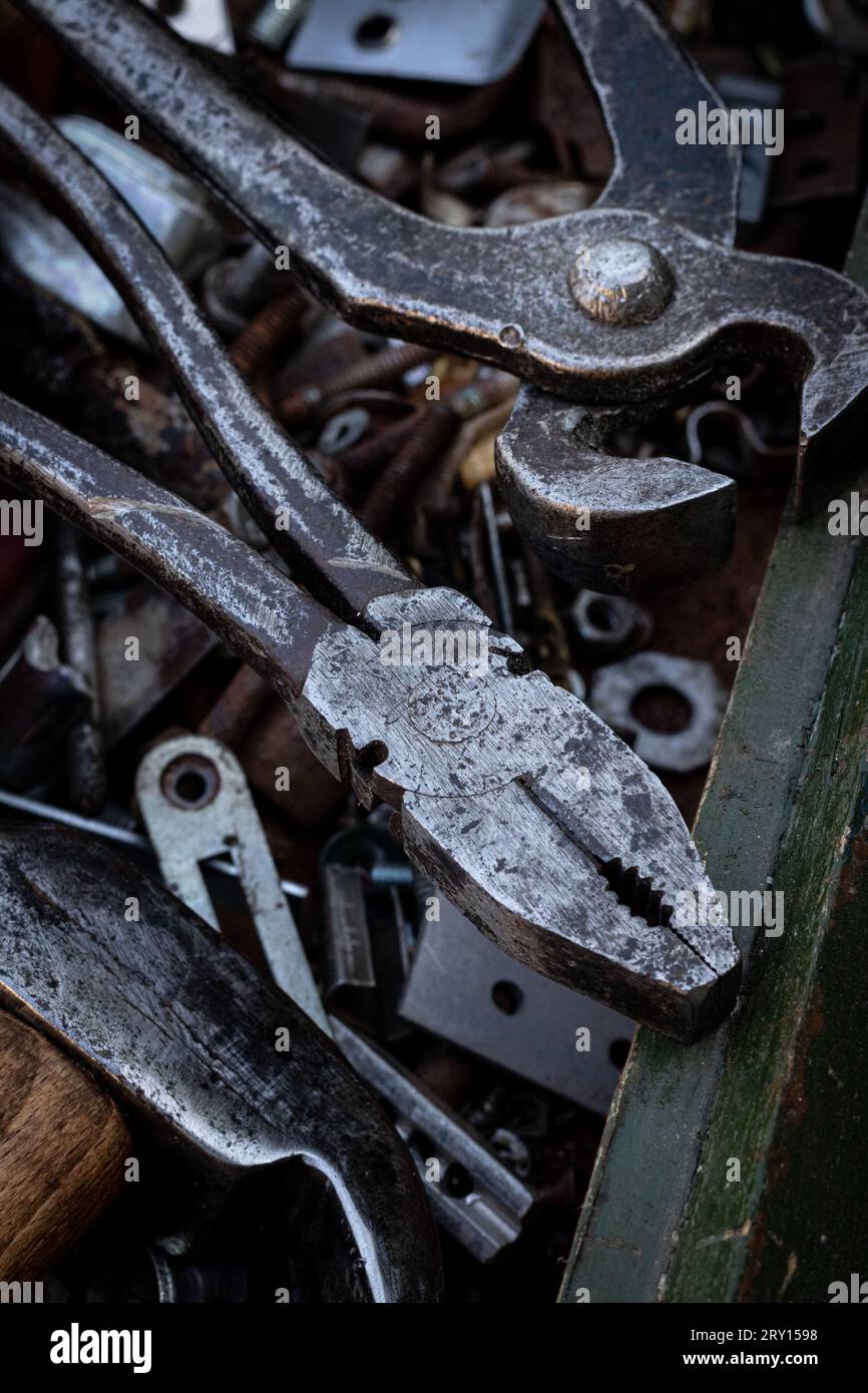 Old work tools lie on a wooden tool box Stock Photo
