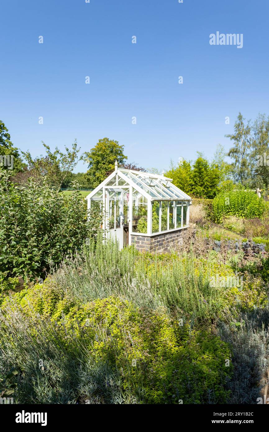 Greenhouse in English vegetable garden Stock Photo Alamy