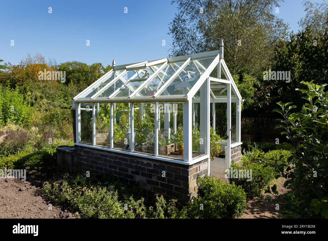 Greenhouse in English vegetable garden Stock Photo Alamy