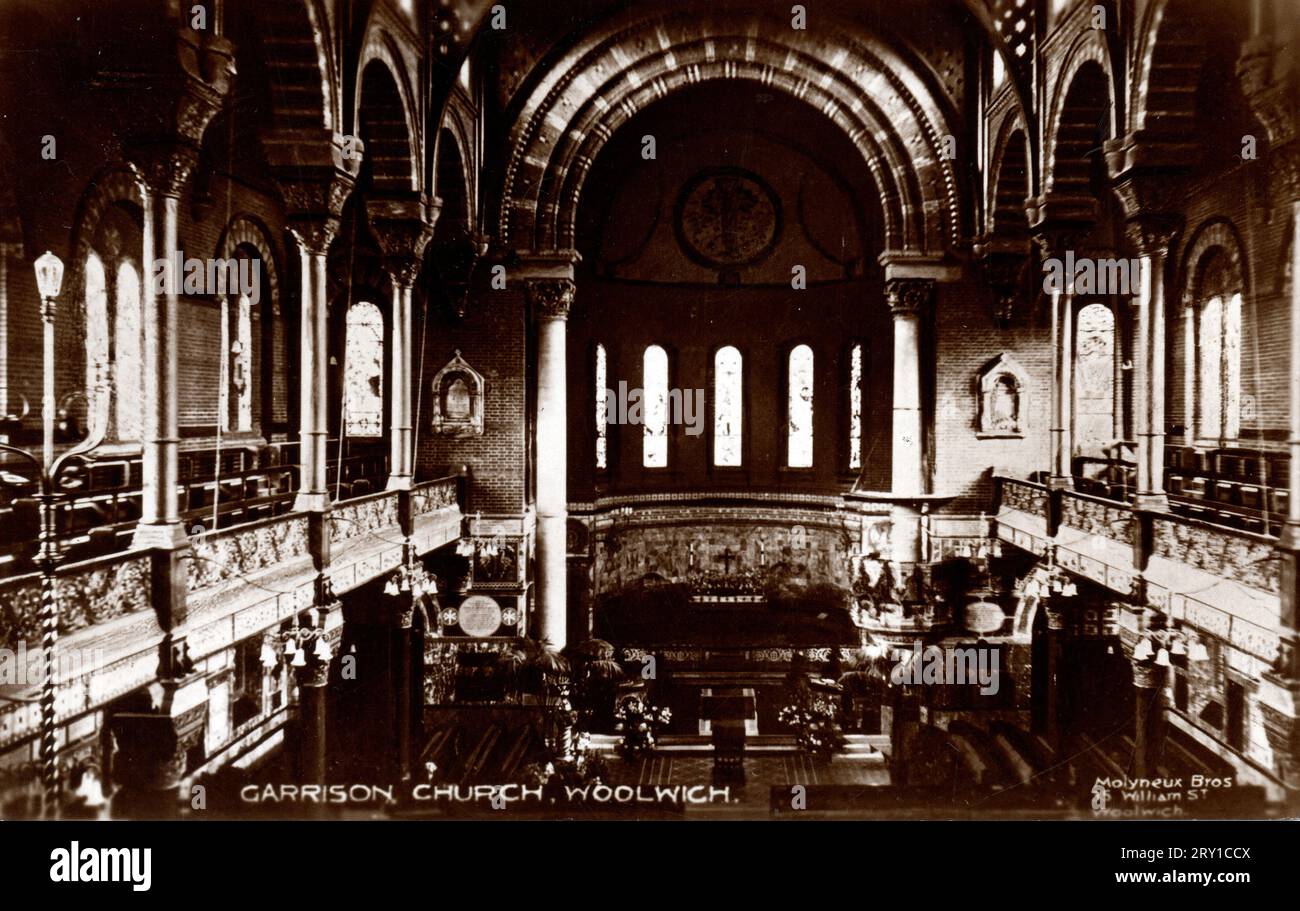 19th century postcard of the interior of St George's Church, Woolwich Garrison, London, circa 1900. The dhurch was designed by Thomas Henry Wyatt in a Early Christian/Lombardic Romanesque style with Byzantine influences in the interior, not dissimilar to Wyatt's design for Wilton Parish Church in Wiltshire.. Building started in 1862 and it was consecrated 1863. The church suffered severe bomb damage in 1944, and was finally demolished in 1970, retaining parts of the building as a memorial. Stock Photo