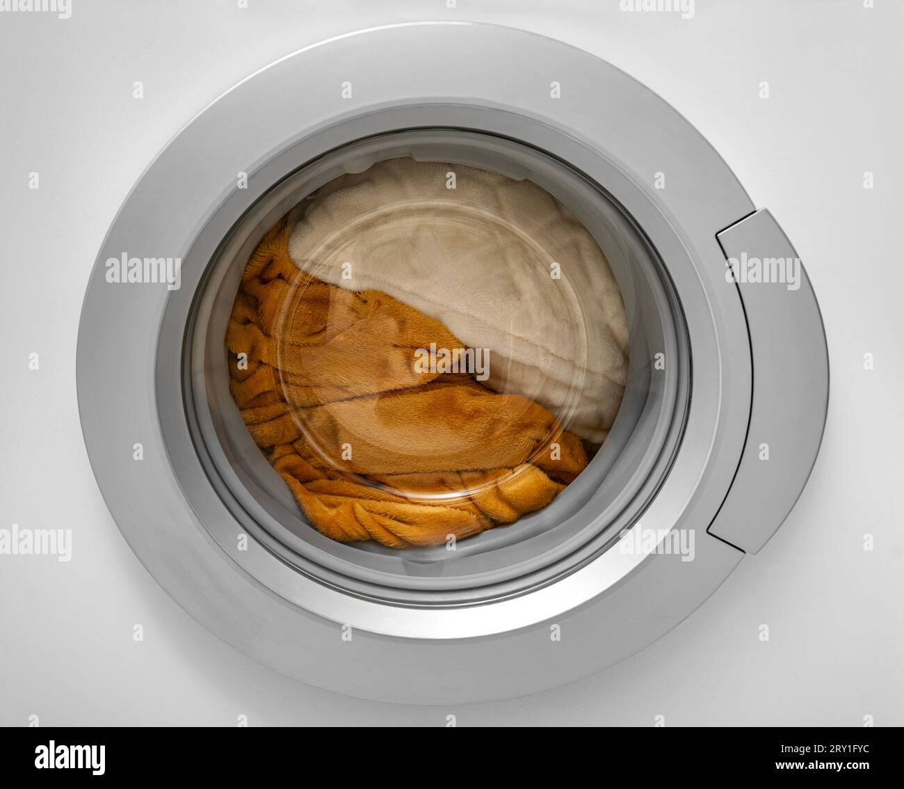Washing blankets and pillows in the washing machine Stock Photo Alamy