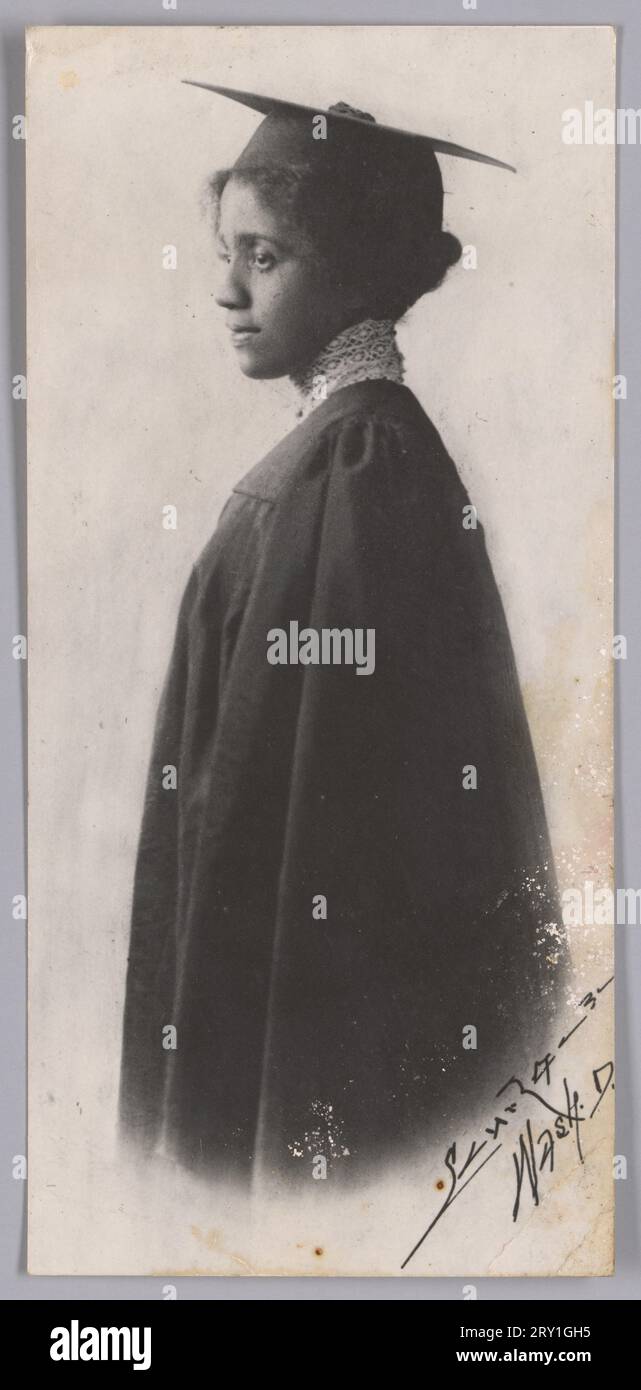 Black and white portrait of a woman in graduation attire. The woman is ...