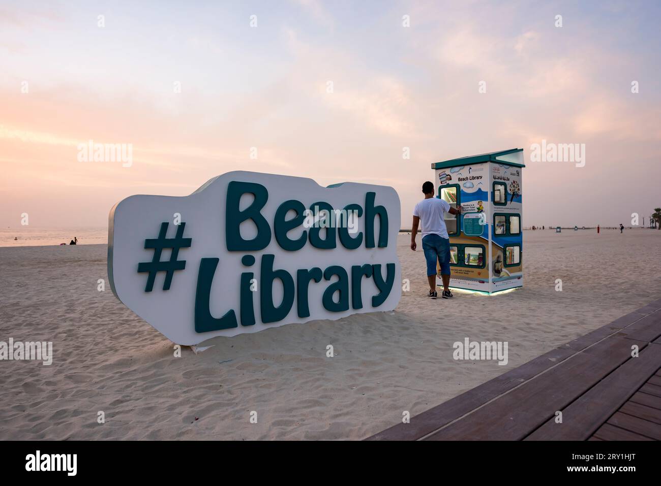 Dubai, United Arab Emirates, May 13th, 2017. A man taking a book from