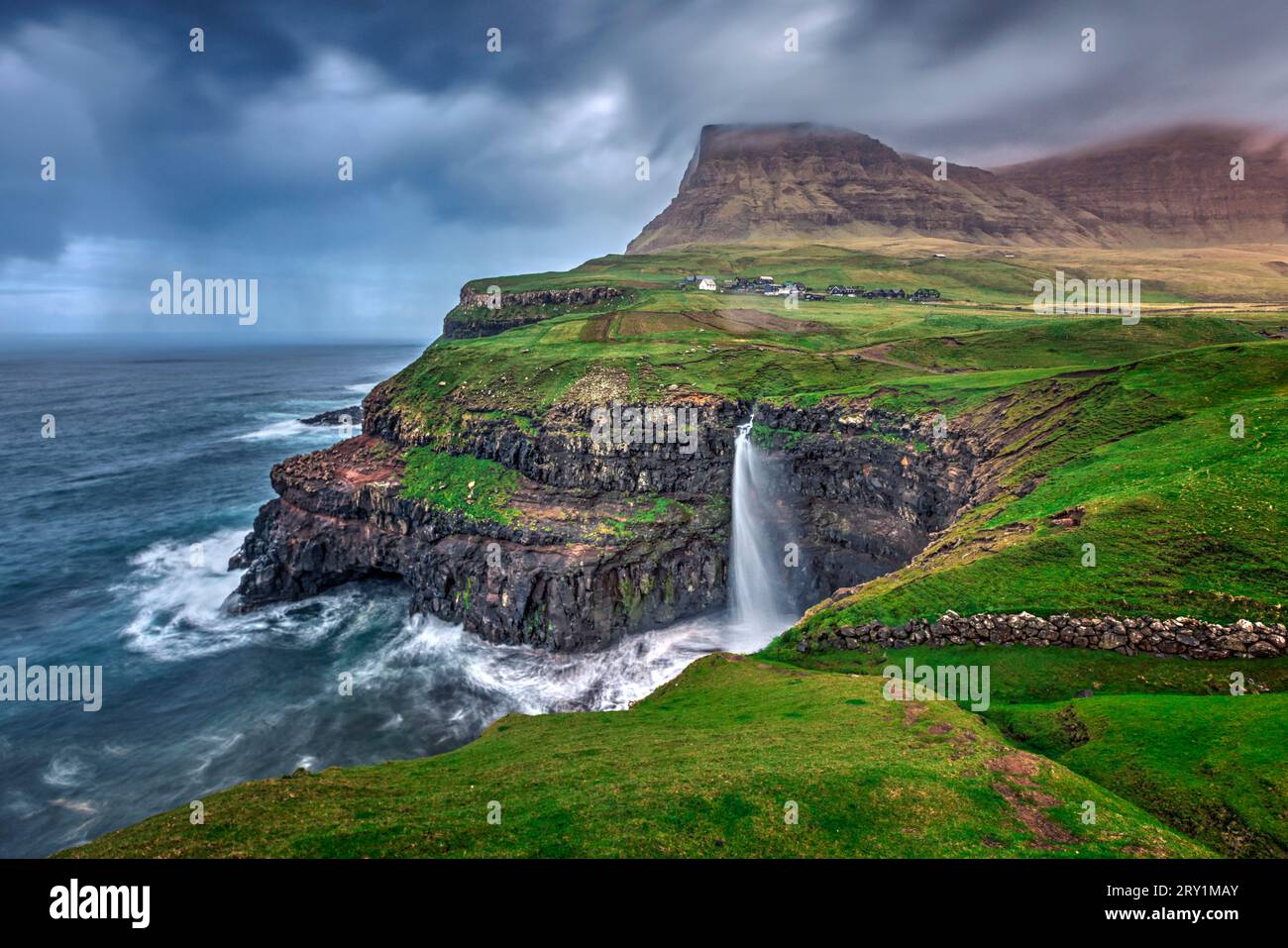 Spectacular Mulafossur waterfall on the island Vagar in the Faroe Islands Stock Photo