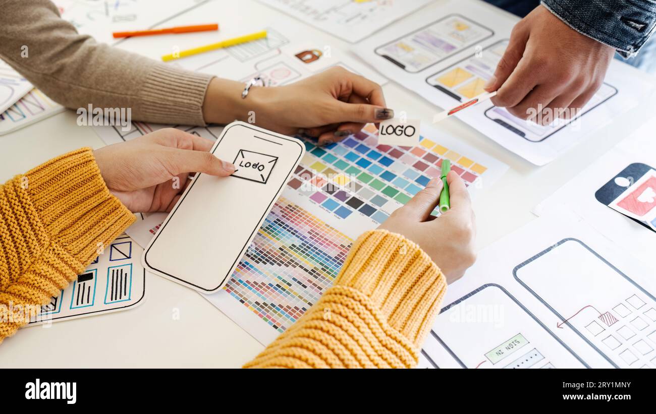 team of UI UX web designer are working together to develop mobile ...