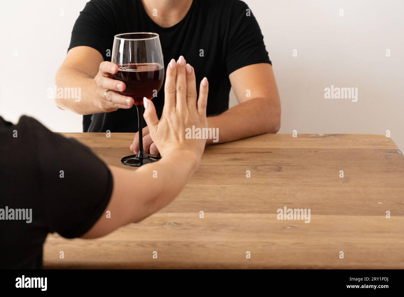 Empowered Woman Declining Alcohol: NOLO, Abstinence, Confronting Alcohol Issues, Saying No to Drinks at Social Gatherings, Substance-Free Lifestyle Stock Photo