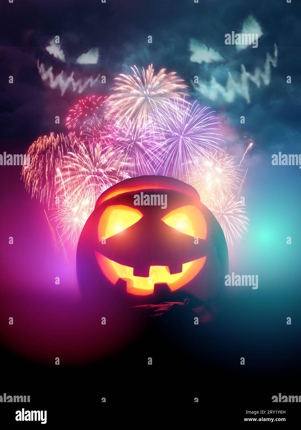 happy halloween poster background design! Featuring fireworks spooky faces and a glowing Jack O lantern pumpkin. Stock Photo