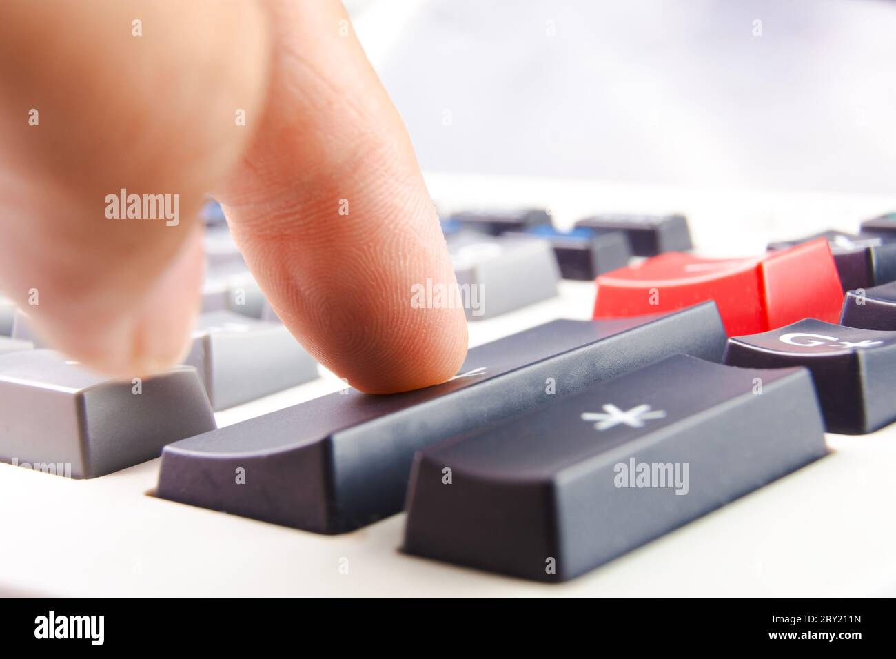 Close up of accountant hand pressing calculator on desk, Finger pressing plus button on calculator. Finance concept Stock Photo