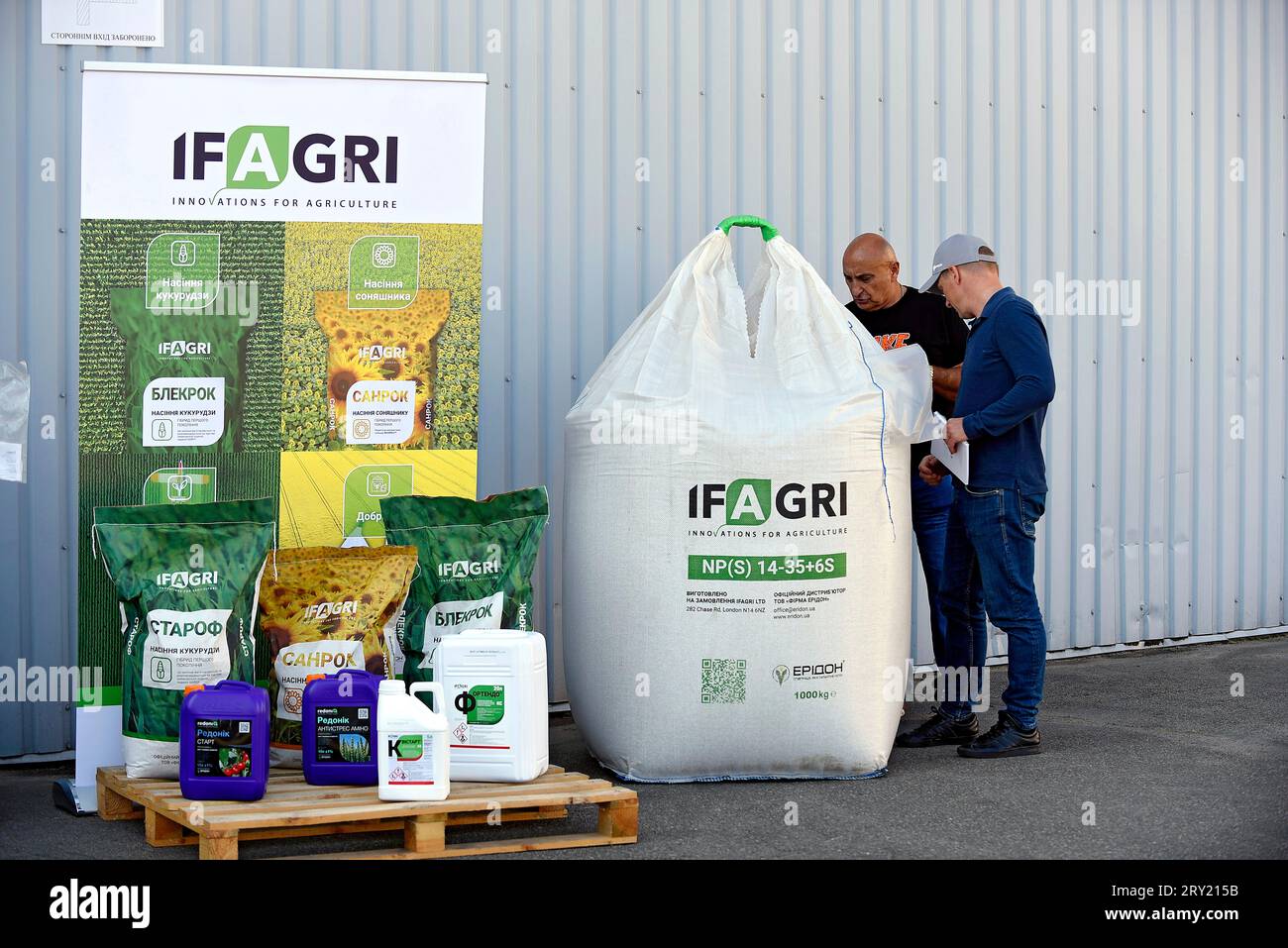 KYIV REGION, UKRAINE - Sacks an canisters with seeds and fertilizers ...