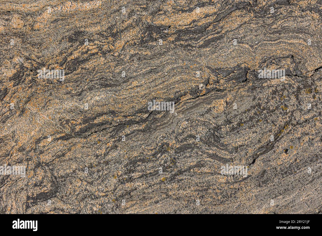 Granite structure with wavy lines and small line breaks. Background pattern natural stone with brown gradient. light and dark spots in the stone due Stock Photo