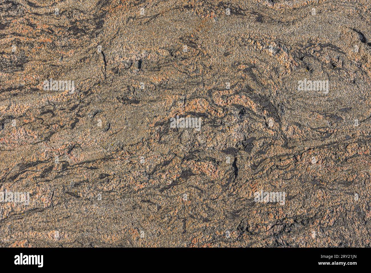 brown granite structure with wavy curved lines and a small line break. Background pattern natural stone with brown gradient. light and dark spots Stock Photo