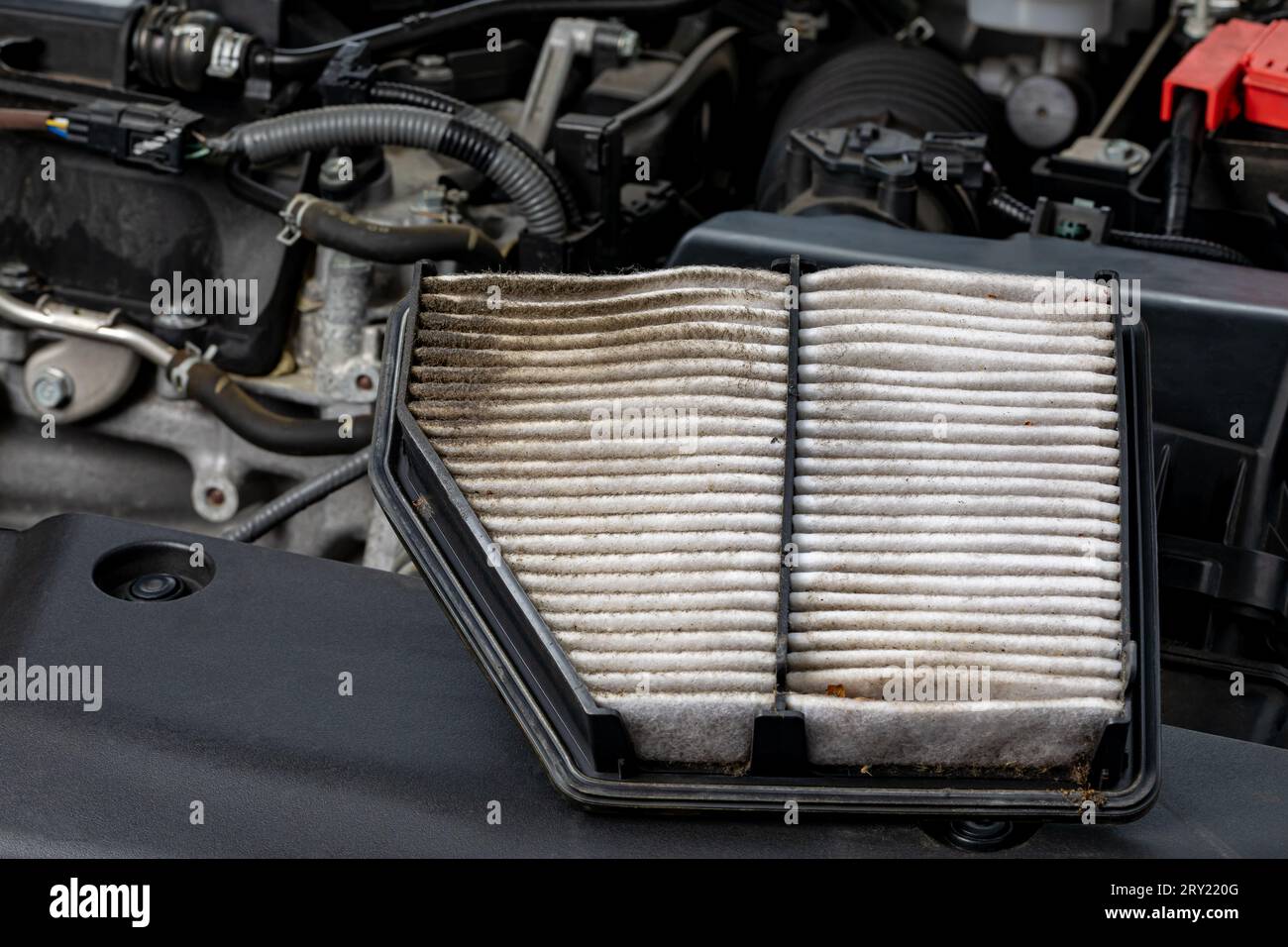 Dirty air filter on vehicle engine. Automotive repair, maintenance