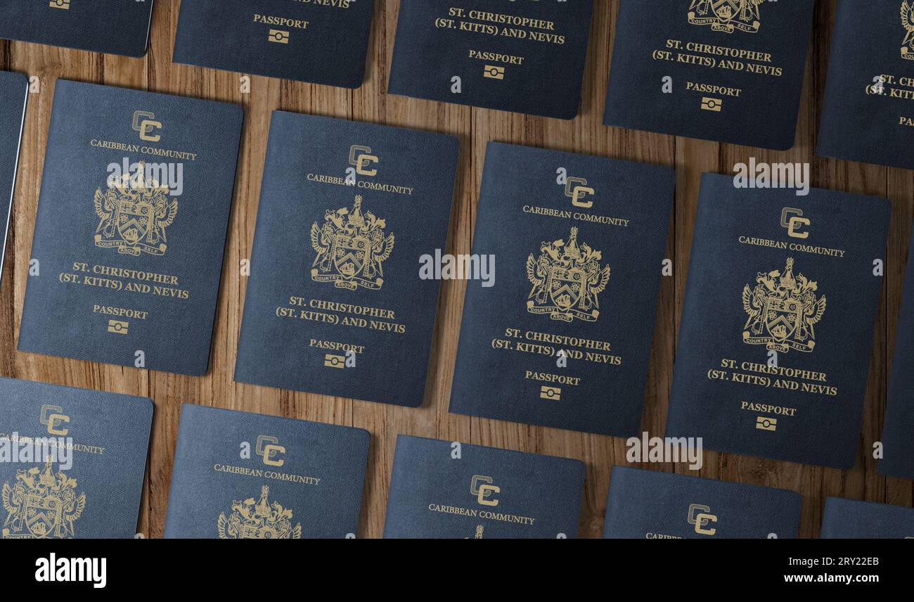 Passports of the Caribbean state of Saint Kitts and Nevis, top view, on a wooden table Stock Photo