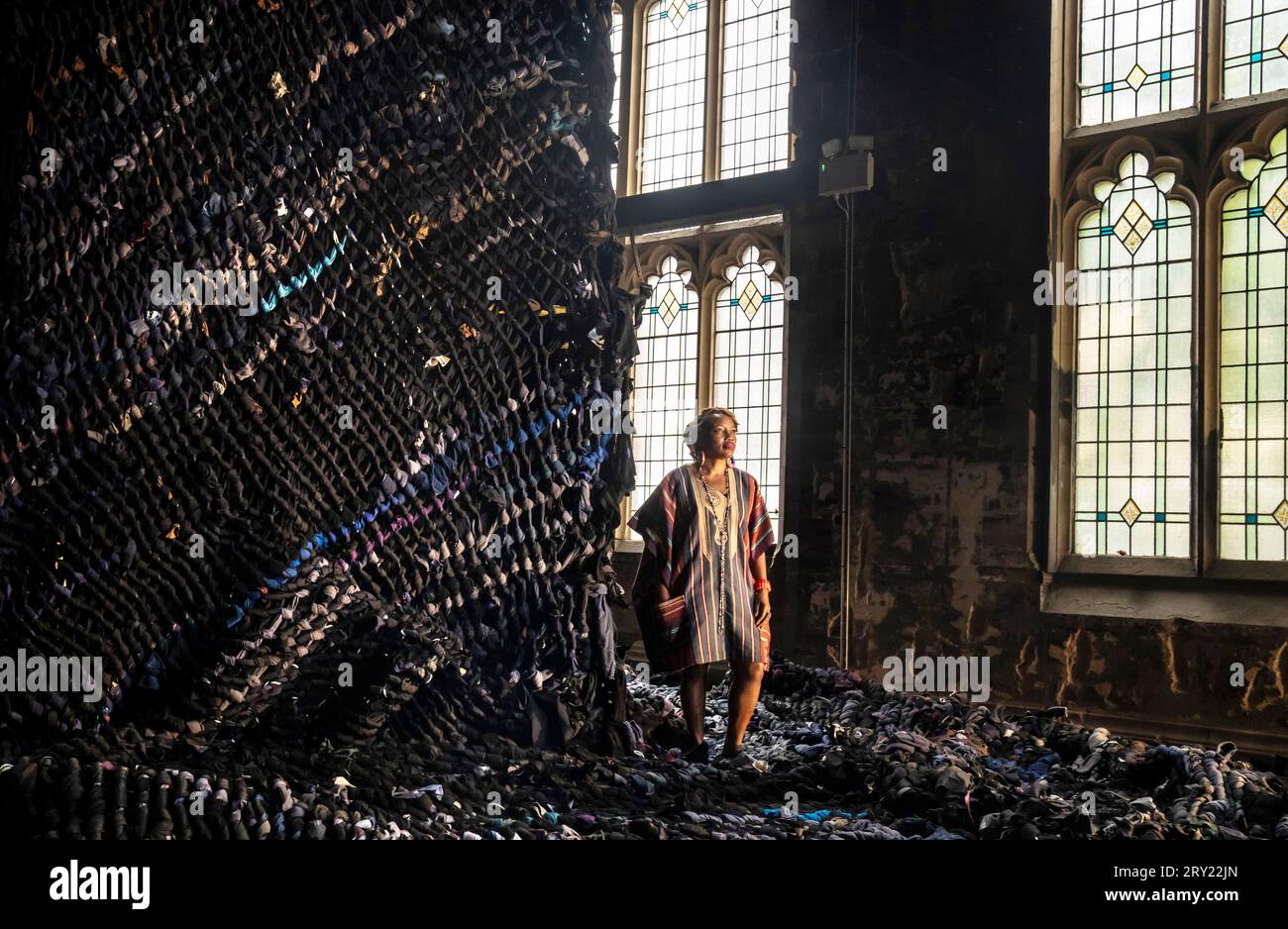 Nigerian artist Victoria Udondian's with her wall hanging that was made