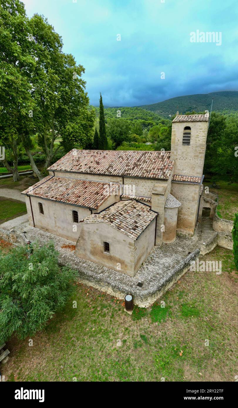 Aerial View of the Rustic Vaugines Church, Nestled in the Heart of Provence, Vaucluse, PACA, Captured through Vertical Drone Photography Stock Photo