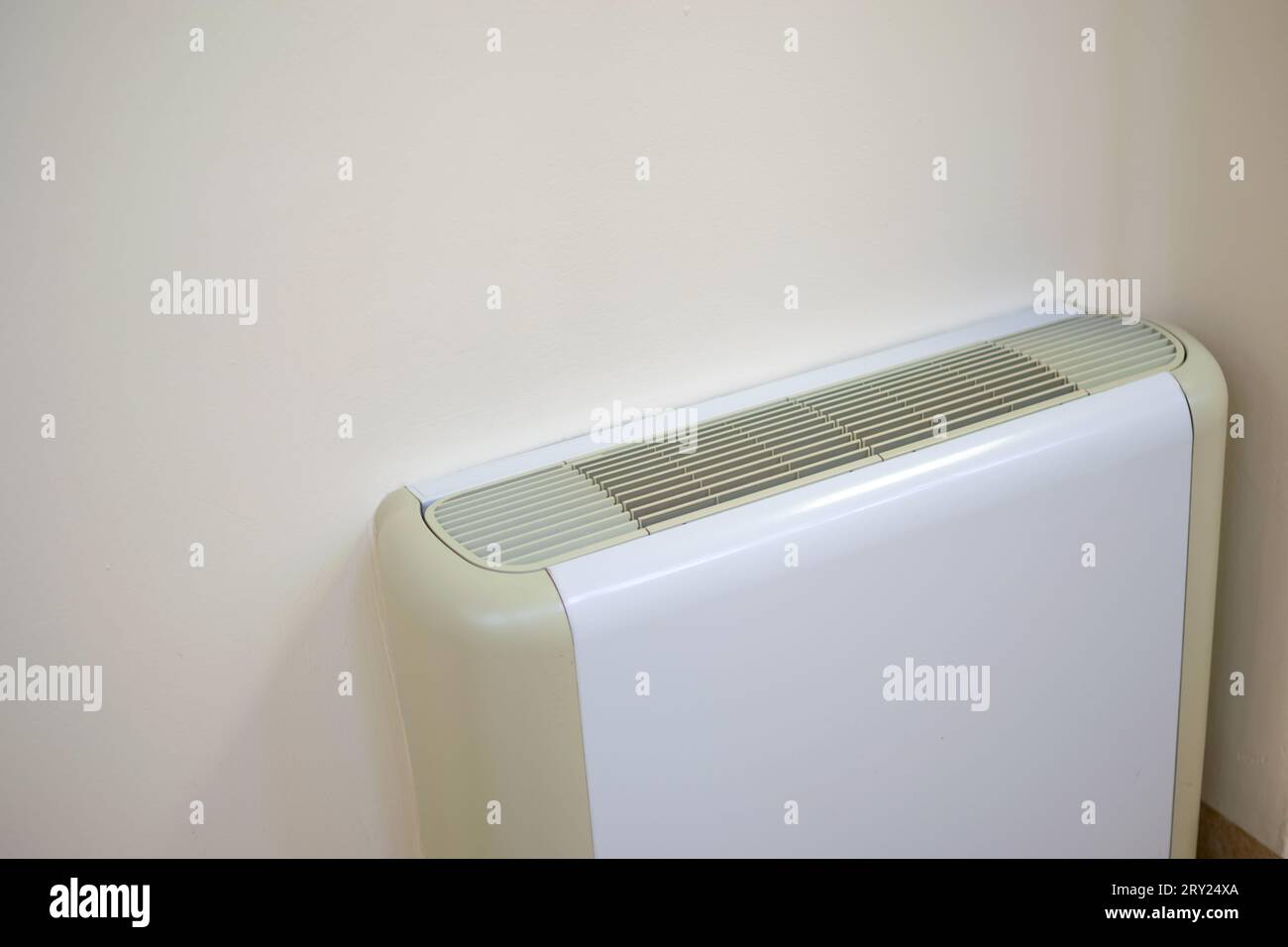 Air conditioner on clear wall for different seasonal climate and energy concepts Stock Photo