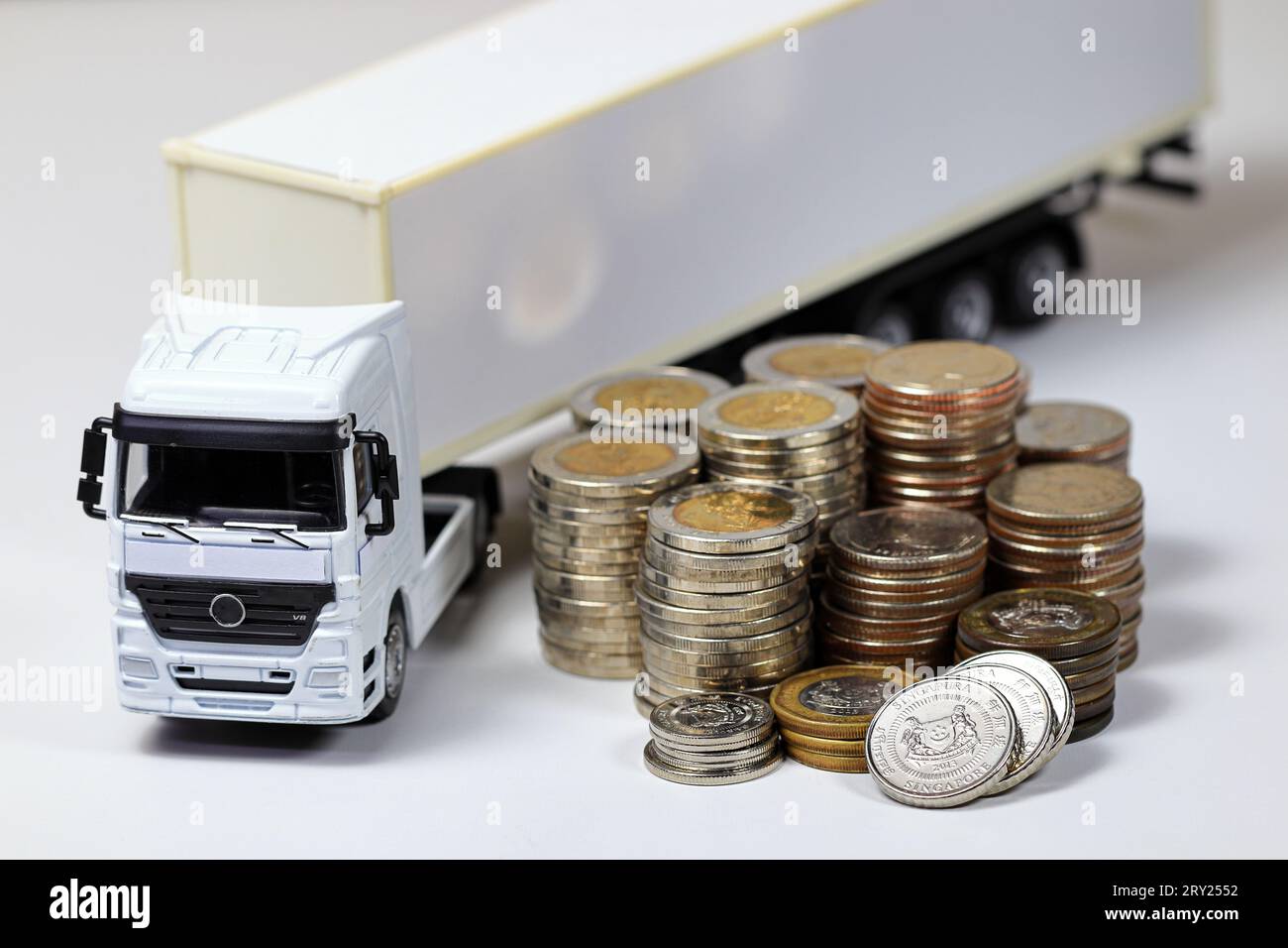 White Container Truck with pile of coins, business and financial ...