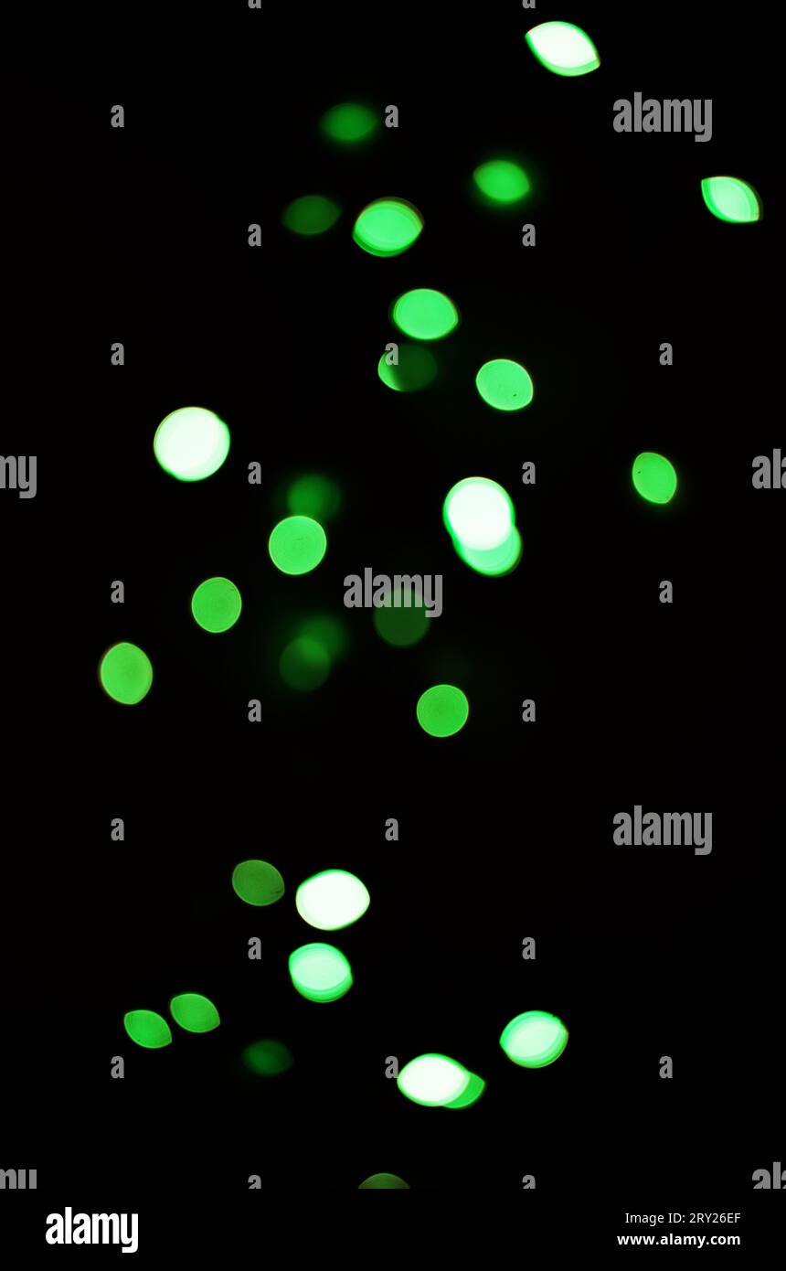 Green light, bokeh and shine on black background isolated on a mockup ...