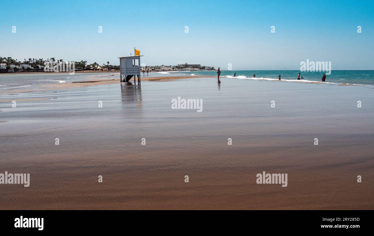 Lifeguard tower on a beach at high tide Stock Photo