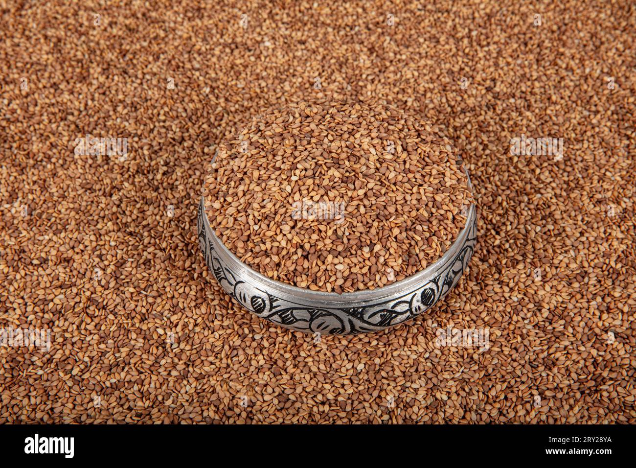 Roasted sesame seed. Pile of sesame seeds as background, spice or ...