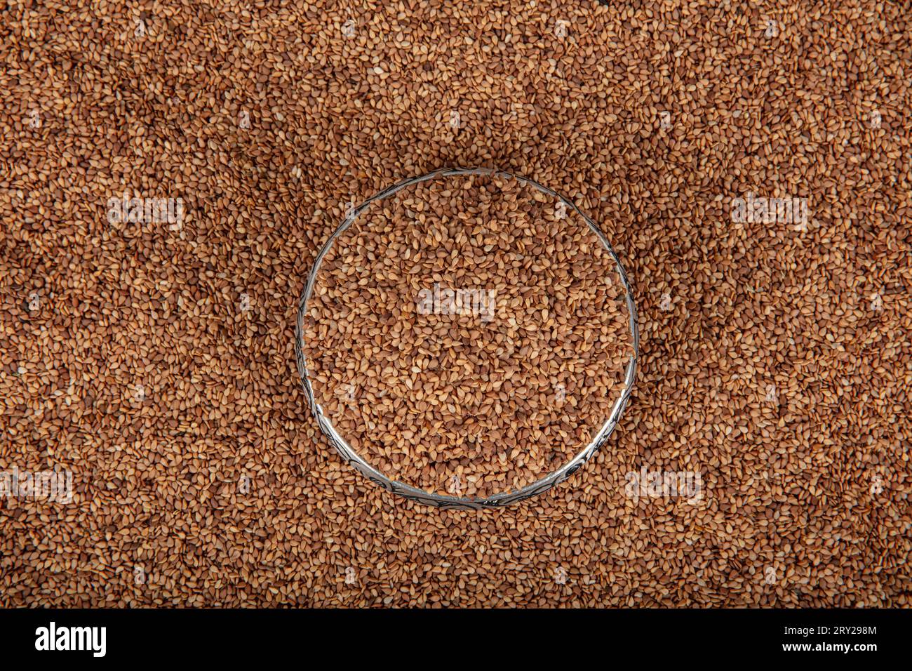 Roasted sesame seed. Pile of sesame seeds as background, spice or ...