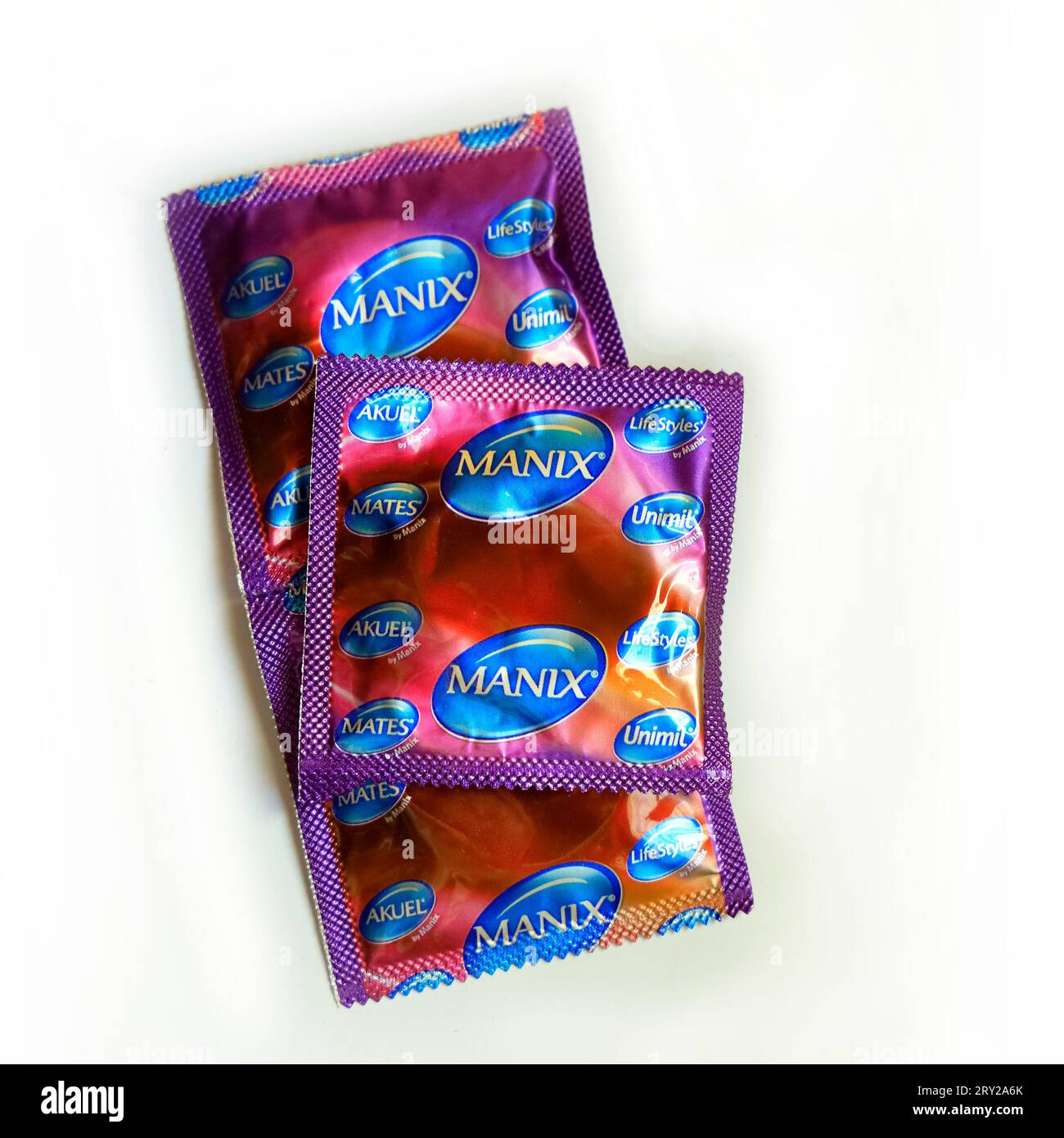 Foil packs of three condoms - Manix. Studio. September 2023. cym Stock Photo