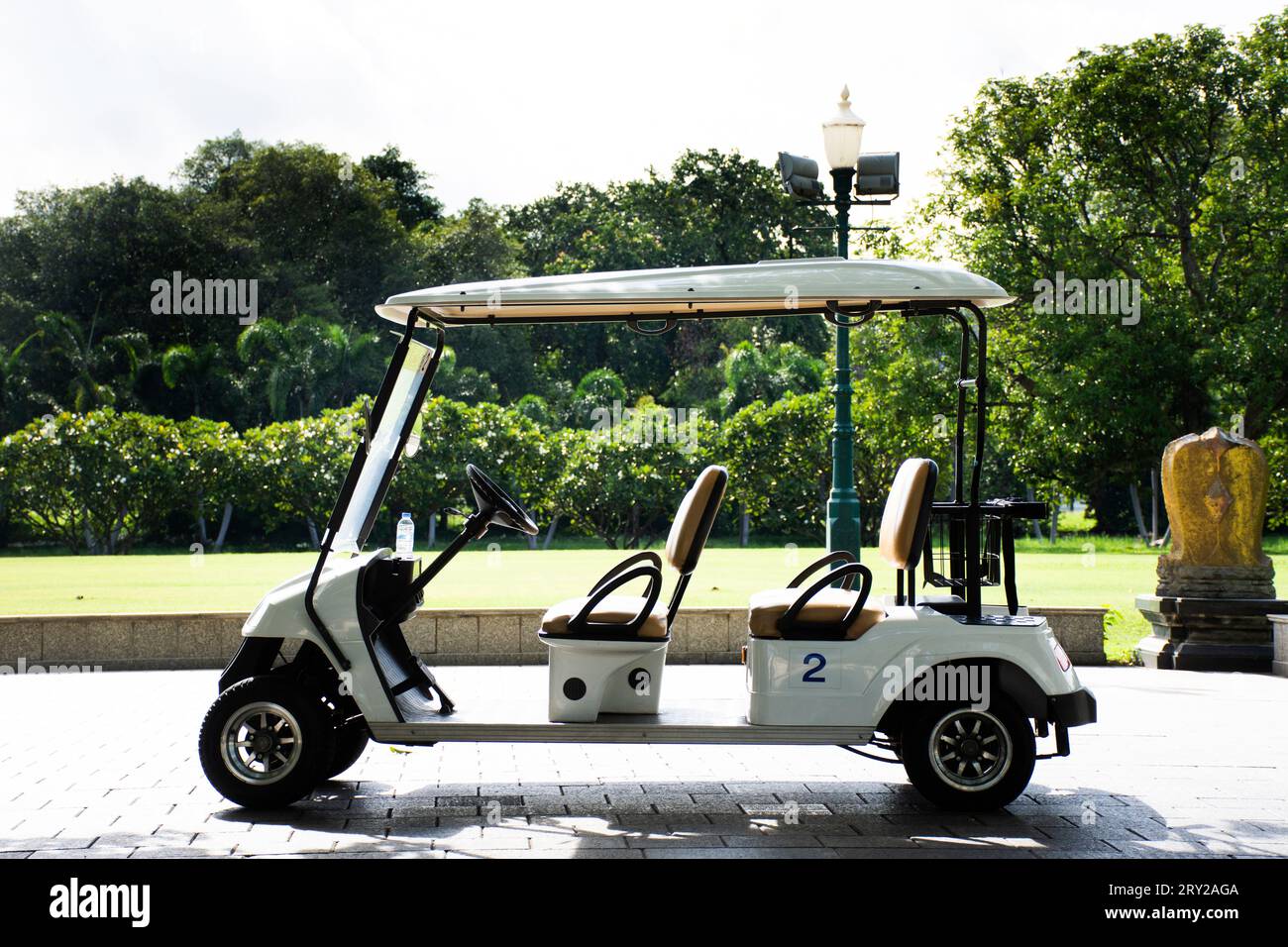 Golf carts electric car or electrical vehicle stop on street road in