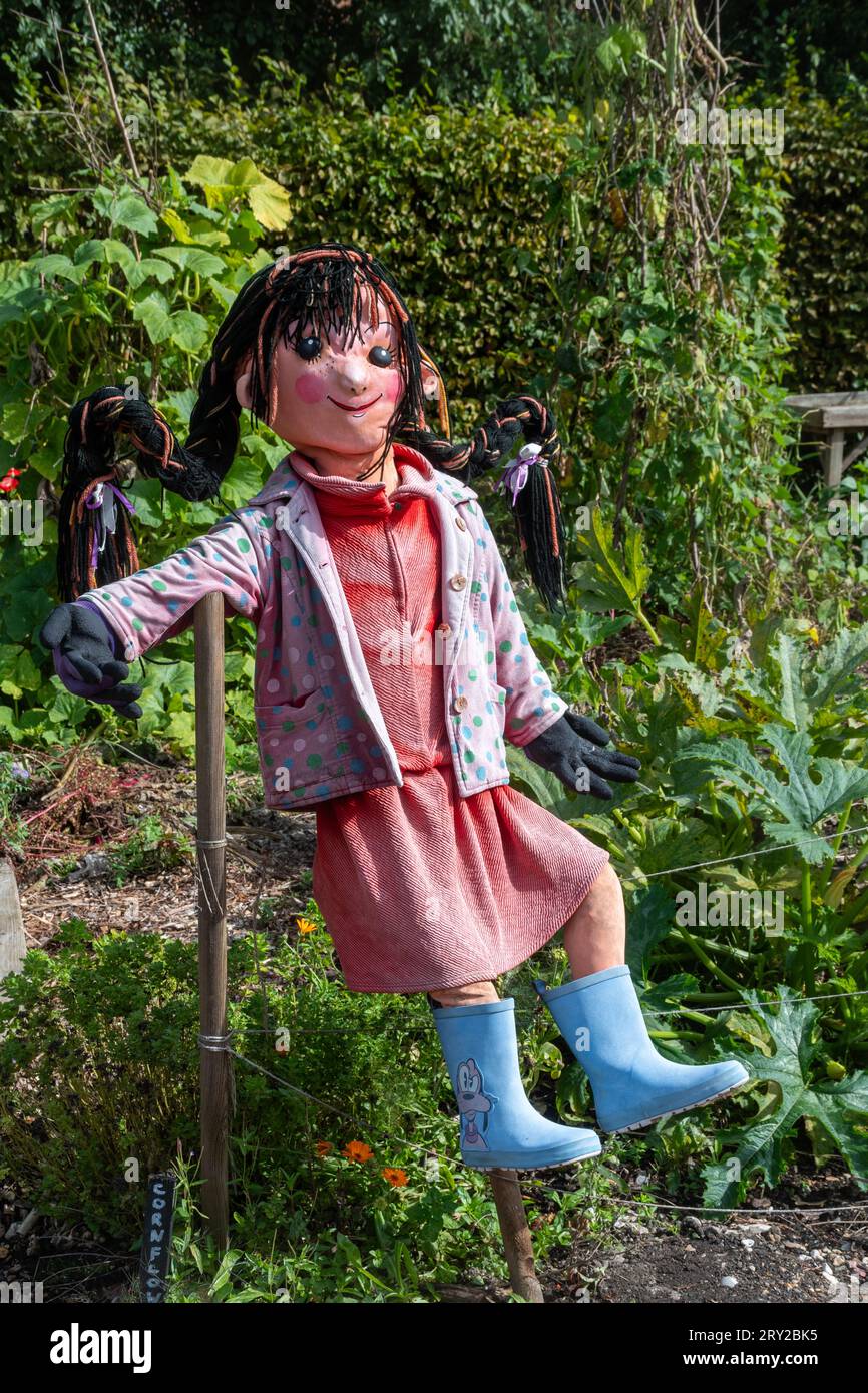 Scarecrow dressed as young girl in Patrick's Patch garden in Beaulieu, Hampshire, England, UK Stock Photo
