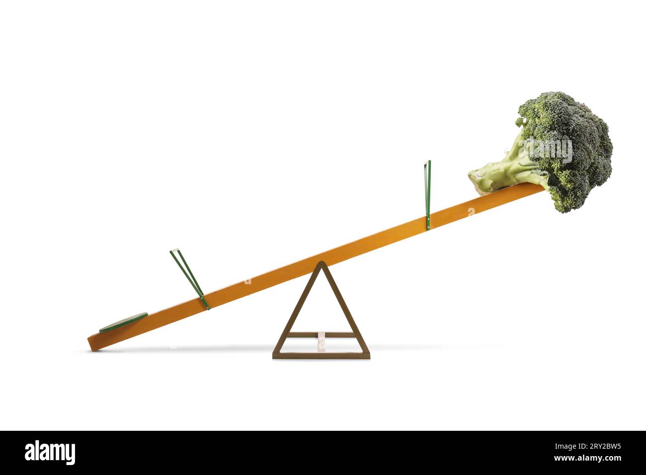 Studio shot of a healthy vegetable broccoli on a seesaw isolated on white background Stock Photo