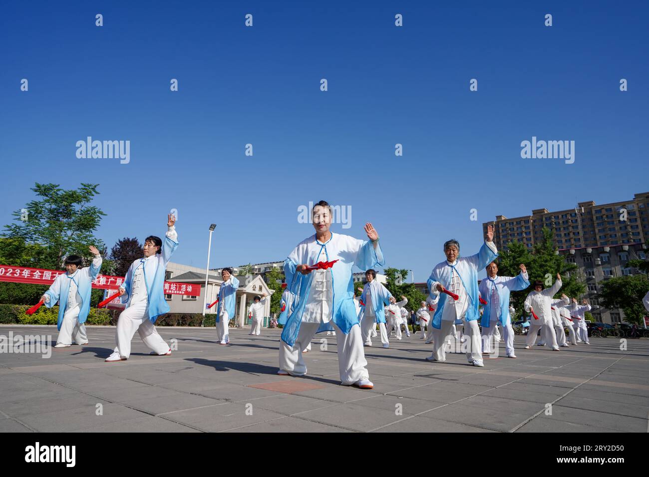 luannan county, China - May 18, 2023: Tai Chi Kung Fu Fan Performance on the Square, North China Stock Photo