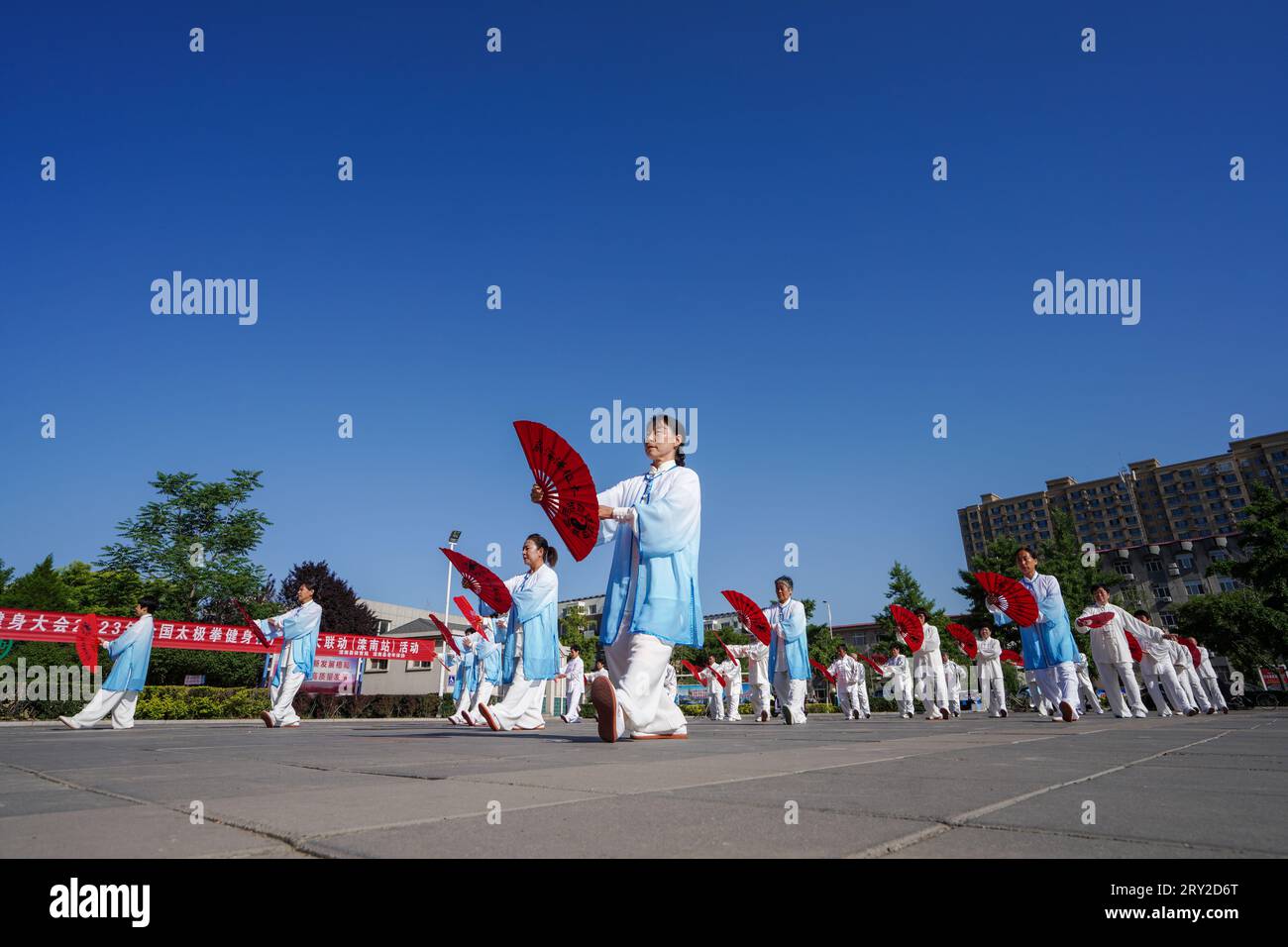 luannan county, China - May 18, 2023: Tai Chi Kung Fu Fan Performance on the Square, North China Stock Photo
