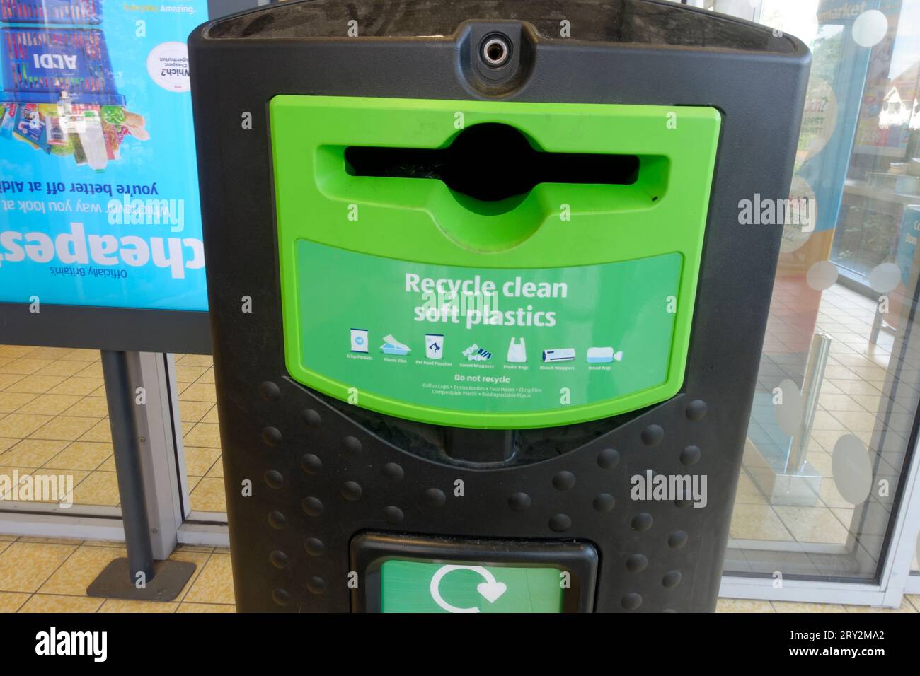 Recycling soft plastics bin at entrance to Aldi Stratford UK Stock Photo