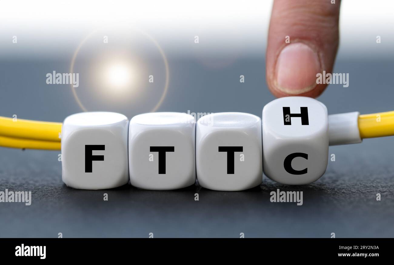 Hand turns dice and changes the expression Fiber to the curb (FTTC) to ...