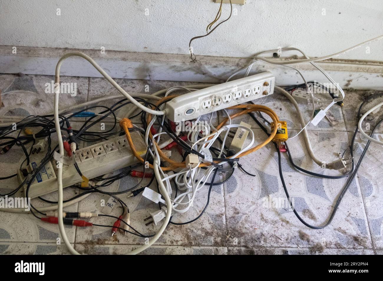 Electrical rats nest tangeled in a home Stock Photo