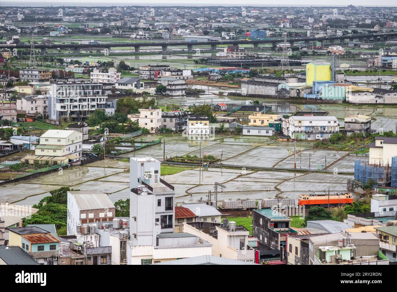 Mixture of old housings and new development between highway and railway in Jiaoxi, township, Taiwan Stock Photo