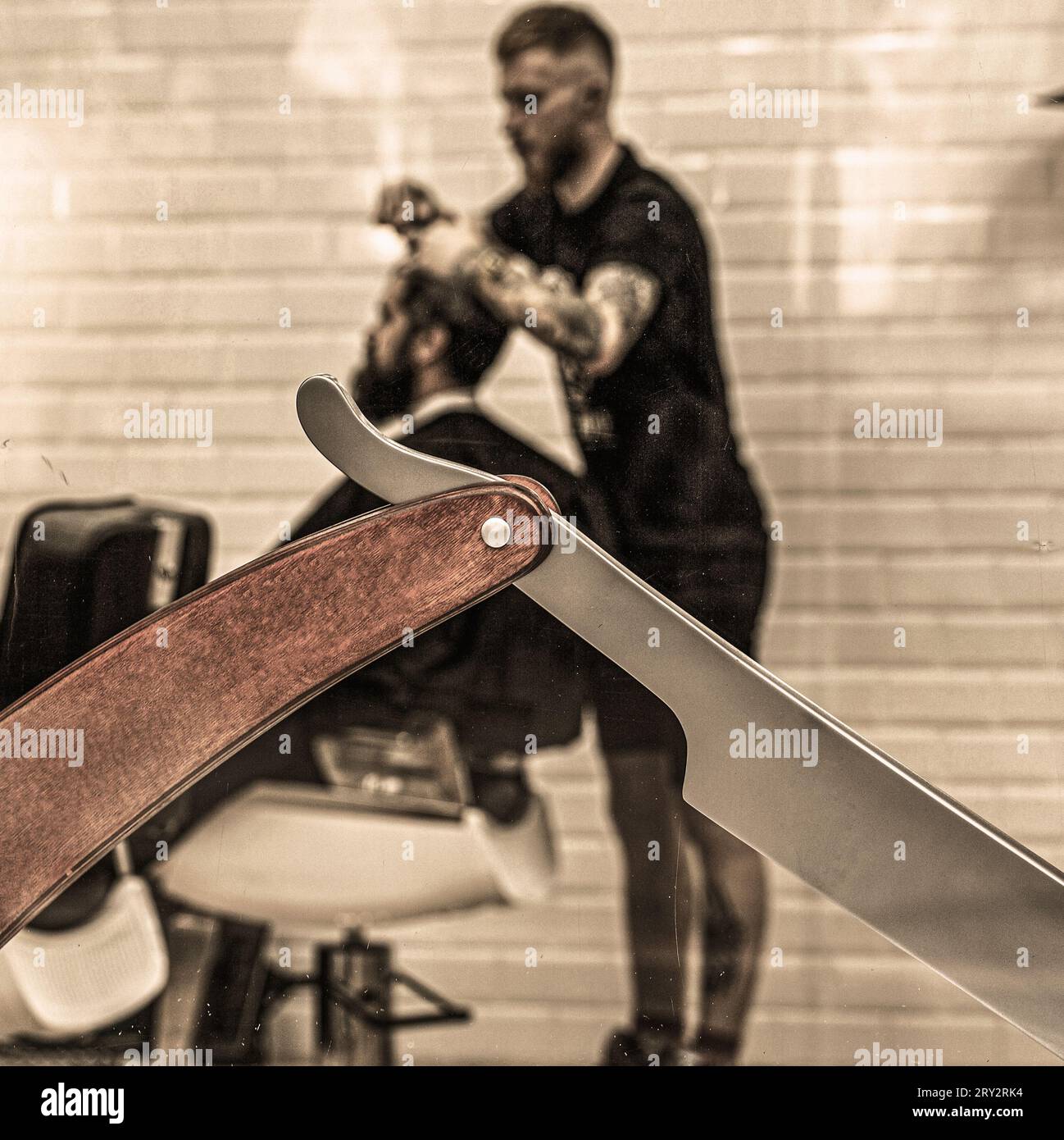 Barber shop, razor. Vintage straight razor. Hair salon. Closeup